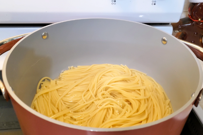 Pot filled with cooked noodles