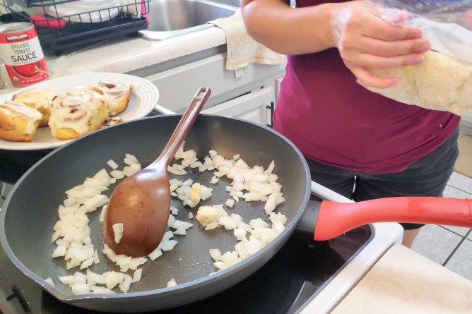 skillet full of fresh onions and garlic